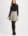 Chic pointelle accents give this classic knit turtleneck an extra splash of style.TurtleneckPointelle details at shouldersLong sleeves with cinched cuffs65% viscose/28% nylon/7% elastaneDry cleanImportedModel is 5'11½ (181 cm) wearing US size Small.