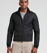 The trim, quilted nylon jacket keeps your look simple and sharp when the weather turns chilly.