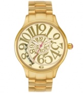 Follow Alice down the rabbit hole with this funky watch by Betsey Johnson. Gold tone stainless steel bracelet and round case. Champagne dial features swirling gold tone numerals, gold tone hour and minute hands, signature fuchsia second hand and logo. Quartz movement. Water resistant to 30 meters. Two-year limited warranty.