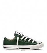 Go green with these classic Converse sneakers featuring a the quintessential All Stars rubber sole with sporty black stripes.
