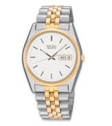 A timeless, handsome look from Seiko. Two-tone stainless steel bracelet and round case with textured gold tone bezel, 40mm. White dial features stick indices, minute track, day and date indicator in English or Spanish, luminous hands and logo. Quartz movement. Water resistant to 30 meters. Three-year limited warranty.