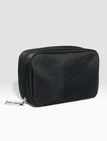 Now in sleek black nylon. The bag Bobbi uses most often for her everyday beauty essentials. Sized to hold staples like Lip Color, Everything Mascara, and Creamy Concealer Kit. Features interior pockets for small tools. (Cosmetics sold separately.) Now in sleek black nylon. The bag Bobbi uses most often for her everyday beauty essentials. Sized to hold staples like Lip Color, Everything Mascara, and Creamy Concealer Kit. Features interior pockets for small tools. (Cosmetics sold separately.)