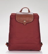 Get on-trend style with this versatile leather-trimmed backpack from Longchamp. Folds for easy packing.