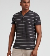 Wide-spaced narrow stripes accent this comfy slub henley from Converse.