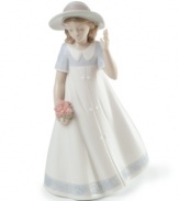Picking posies. A young girl welcomes spring in a lovely white dress, presenting an image of freshness and youth in this darling porcelain figurine from Lladró.