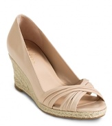 Step into spring with an elegant open toe jute wedge. From Cole haan.