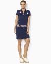 In celebration of Team USA's participation in the 2012 Olympics, a figure-flattering polo dress in stretch cotton mesh is adorned with bold country embroidery.