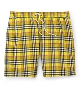 Packing for a weekend in paradise? A brighter check print and relaxed fit distinguishes Burberry's lightweight swim trunk.