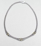 A chunky strand of large and little sterling silver links includes cabled texture links framing ones of smooth 18k gold. Sterling silver and 18k yellow gold Length about 16½ Lobster clasp Made in Italy