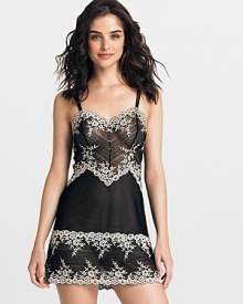 A body skimming sheer lace chemise with flattering floral details all over. A body skimming sheer lace chemise with flattering floral details all over.