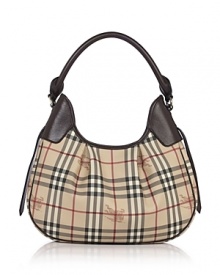 Printed PVC hobo with leather trim and single shoulder strap. Goldtone hardware and pleated accents. Top zip closure. Interior zip, cell phone, and additional pockets. Lined. Printed PVC hobo with leather trim and single shoulder strap. Goldtone hardware and pleated accents. Top zip closure. Interior zip, cell phone, and additional pockets. Lined.