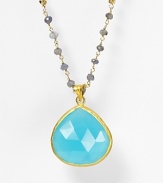 Small gray iolite stones lead to a dazzling, sky-blue faceted chalcedony pendant. By Coralia Leets.