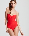 Reveal just the right amount of skin in this bandeau one piece from Miraclesuit. The one piece suit boasts crossbody rouching to create a plunge-perfect silhouette.