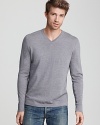 A soft, sleek sweater from Elie Tahari in fine merino wool. Contrast stripes along inner sleeves and sides.