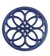 This quaint cast iron trivet, a charming piece to place on any countertop or dining table, features a classic pattern that protects virtually any surface from hot pots and pans. Limited lifetime warranty.