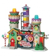 Get a taste of what goes on at the Yummy Gummy Gumdrop Factory by Department 56. A tower of fruit flavors, candy cane lamppost and sugar-coated assembly line prove irresistible to every sweet tooth in North Pole Village.