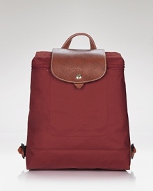 Get on-trend style with this versatile leather-trimmed backpack from Longchamp. Folds for easy packing. Get on-trend style with this versatile leather-trimmed backpack from Longchamp. Folds for easy packing.