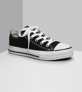 Low cut Converse All Stars. This classic canvas sneaker set the standard in cool and comfort. Available in kids sizes. With lace-up canvas uppers, contrast stitching and rubber sole and toe.
