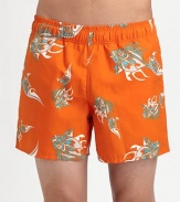 A colorful option for a dip in the pool or a day at the beach in koi-printed nylon. Elastic waist Mesh lining Inseam, about 5 Polyester Hand wash Imported 