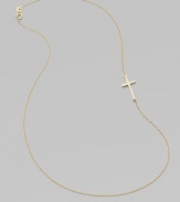 A wispy chain of 14k yellow gold features a cross pendant set askew for a modern edge.14k yellow gold Length, about 16 Pendant length, about ¾ Spring ring clasp Made in USA