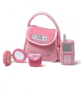 Pink purse with My First Purse embroidered on the front. Includes a cell phone with a mirror function and ring function, touch-and-close mirror compact with a rattle function and a change purse with a touch-and-close fastener.
