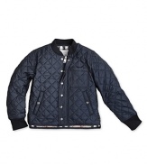 This woodsy quilted jacket features a touch of Burberry's signature check at the collar and lining.