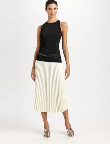This on-trend tea-length silhouette is prettily pleated, for a feminine, wear-with-all feel.Self waistbandConcealed side zipAllover pleatsSilk liningAbout 28 from natural waist57% acetate/43% viscoseDry cleanImported of Italian fabricModel shown is 5'10 (177cm) wearing US size 4. 