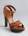 Timeless yet directional, Lauren Ralph Lauren has given these lofty platform sandals an equestrian aesthetic.