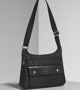 Longchamp Planete crossbody bag in nylon with single adjustable crossbody strap, silvertone hardware and leather trim. Features front zip closure and front exterior flap pocket.
