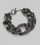 Multiple links with pavé detailing and delicate woven chain.Glass Metal Length, about 7½ Toggle closure Imported 