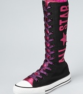 An ultra-high top version of a Converse classic, the All Star, this canvas boot makes a bold statement with large logo lettering and rasberry rose metallic laces.