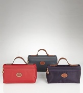 A sleek and stylish nylon cosmetic pouch from Longchamp.