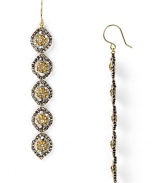 Miguel Ases' gold-flecked earrings are a glamourous take on beads. Equal parts delicate and dramatic, these linear drops beg for a bold lip and slinky gown.