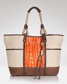 Bag an eclectic accessory with Rafe New York's ikat-print tote. Marrying a roomy silhouette and exotic details, this bag hits the tarmac with with oversized frames and flat sandals. Bag an eclectic accessory with Rafe New York's ikat-print tote. Marrying a roomy silhouette and exotic details, this bag hits the tarmac with with oversized frames and flat sandals.