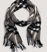 Bundle up in Burberry's soft cashmere scarf with signature giant check print.