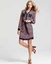 A retro striped print and glimmering gold-tone buttons lend stylish '70s sophistication to this Tory Burch shirt dress. Keep the laid-back vibe going with chunky platforms and strands of golden chains.