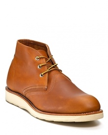 A true classic from Red Wing, the rugged work boot rendered in a chukka silhouette with a wide, stitched welt and contrast rubber sole. A true classic from Red Wing, the rugged work boot rendered in a chukka silhouette with a wide, stitched welt and contrast rubber sole.