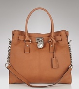 Look chic from work to weekend with this leather tote from MICHAEL Michael Kors. Chain detailing at the straps lends subtle glamour.