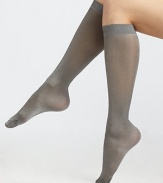 These semi-sheer socks feature a soft metallic sheen. Solid cuffFlat toe seam94% polyamide/6% elastaneMachine washImported 