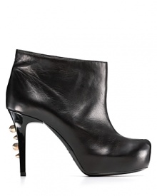 Fierce spikes line the slim heels of these platform leather ankle boots for sharp, industrial chic. By Ruthie Davis®.