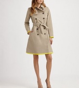 This classic trench style is trimmed with vibrant piping in an on-trend hue.Foldover collarGunflapDouble-breasted button frontSelf beltSide slash pocketsContrast trimBack rainflapFully linedAbout 37 from shoulder to hem82% cotton/18% silkDry cleanMade in France of imported fabricModel shown is 5'11 (180cm) wearing US size 4. 
