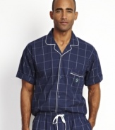 Top off your classic Sunday morning style with this short-sleeved windowpane camp shirt from Nautica.
