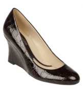 Subtle croc embossing adds a stylish edge to Naturalizer's Ashby pumps--a classic for your workday wardrobe. The wedge heel makes them comfortable and easy to wear from 9 to 5 and beyond. Also available in a smooth leather finish.