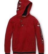 Edgy, vintage-inspired graphics toughen up this practical pullover hoodie by GUESS Kids.