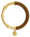 One part Zen and one part colorblock equals two parts fabulous! Jessica Simpson's totally-chic bangle features a serene bamboo setting in gold tone mixed metal combined with stretchable brown polyurethane. Approximate length (when stretched): 10 inches.