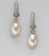 Lustrous white freshwater pearls, with dazzling diamond accents, are ready to hang from your favorite hoops. Diamonds, 0.03 tcw White freshwater pearls 18k white gold Drop, about ¾ Spring clip clasp Imported Please note: Earrings sold separately.