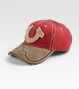 A distressed horseshoe patch is at the center of this perforated hat made of rich, structured cotton.CottonDry cleanImported