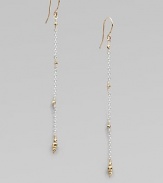 Gracefully dangling strands of sterling silver chain, sprinkled and tipped with glowing faceted beads of 14k gold.14k yellow gold and sterling silverLength, about 2¼Ear wireMade in USA