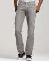 These straight leg 7 for All Mankind jeans in a faded gray wash sit low on the waist with a slim fit through hip and thigh and slight tapering at the ankle. Back pocket signature squiggle detail.