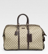 Signature GG plus duffel with leather trim and a retractable handle. Double-zip closure Top handles Light gold hardware Interior zip pocket 21W X 11H X 12D Made in Italy